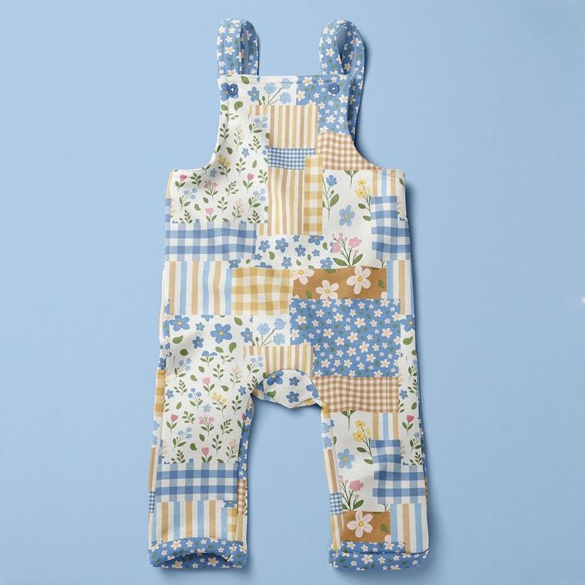 Kids fleece dungarees mockup featuring a patchwork pattern with floral and checkered designs on a light blue background.
