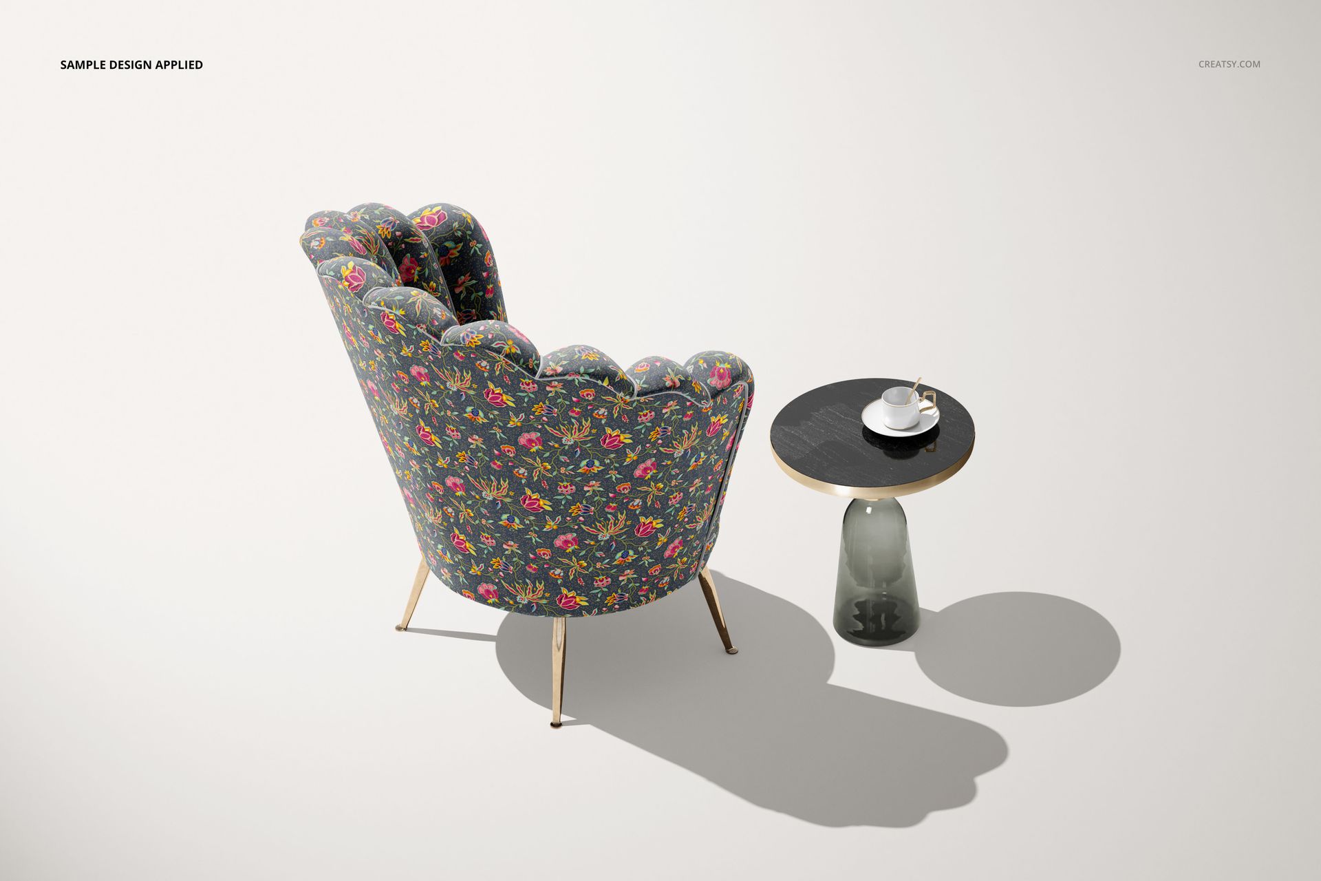 Mockup of a velvet shell armchair featuring a vibrant floral design, viewed from behind next to a minimalist side table.