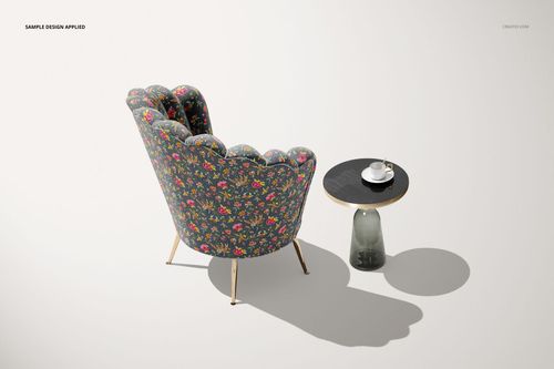 Mockup of a velvet shell armchair featuring a vibrant floral design, viewed from behind next to a minimalist side table.