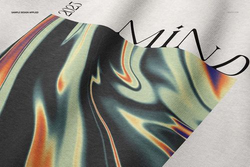 Close-up of an oversized hoodie mockup showing a large hood with a wavy multicolor abstract pattern and text.