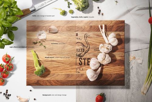 End grain wooden board mockup displayed on a kitchen surface, featuring engraved graphics and fresh vegetables.