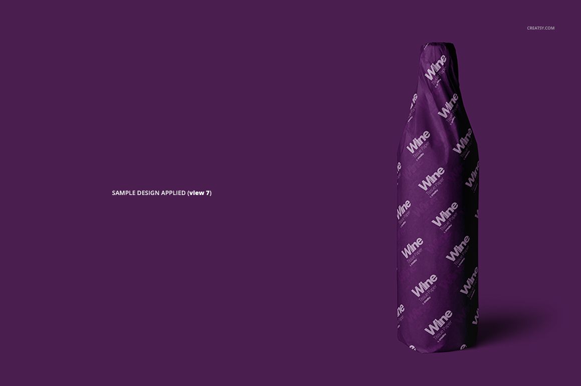 Mockup of a wine bottle covered in purple wrapping tissue featuring white lettering, displayed on a plain backdrop.