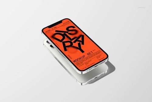 iPhone 12 Pro mockup set featuring two silver smartphones stacked on a white surface, top device screen displaying bold orange graphics.