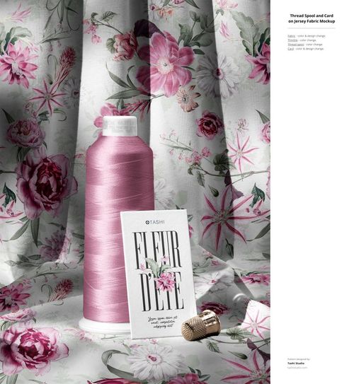 Front view of a jersey fabric mockup with a pink floral pattern, featuring a pink thread spool, card, and thimble.