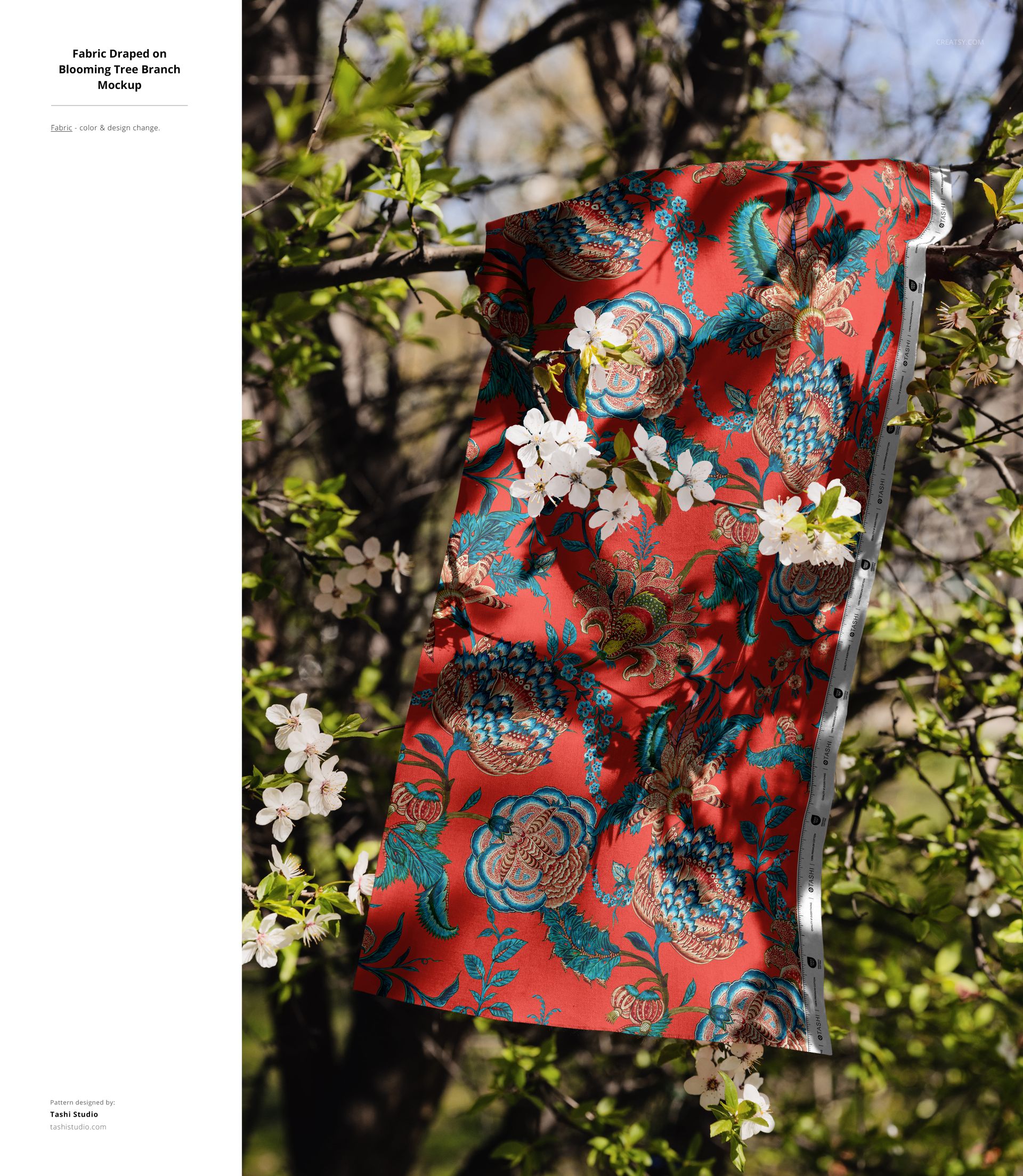 Floral patterned red fabric mockup displayed on a tree branch with spring blossoms and lush green foliage outdoors.