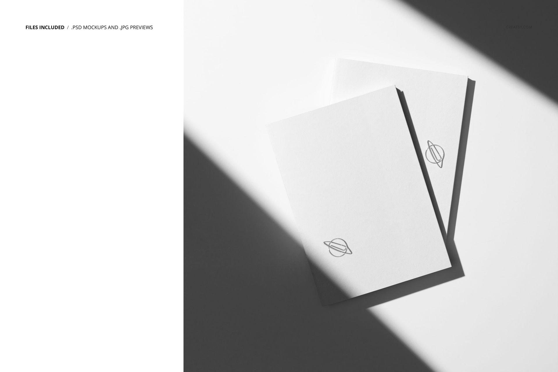 Stationery PSD mockup showing a top-down perspective of two simple planners with minimal design and angled shadows.