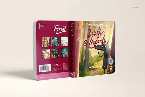 Cardboard baby book mockup showing a front cover with illustrated forest scene and a dragon, opened to reveal back cover.