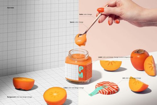 Front view of a persimmon jam jar mockup with colorful label, surrounded by fresh persimmons and a hand holding a spoon.