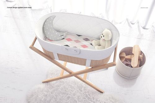 Bassinet liner mockup featuring a white oval bassinet with quilted fabric, moon pillow, and teddy bear, top view.