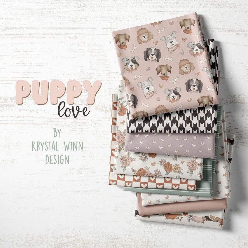 Fabric stack mockup featuring several folded fabrics with dog, bone, and heart patterns in soft pastel colors on a white surface.