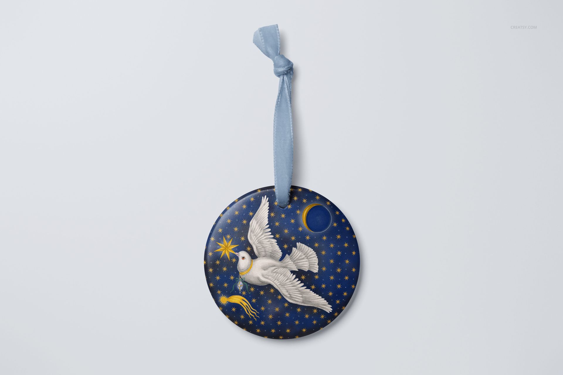 Round handmade ornament mockup with a white dove and gold stars pattern on a dark blue background, front view.