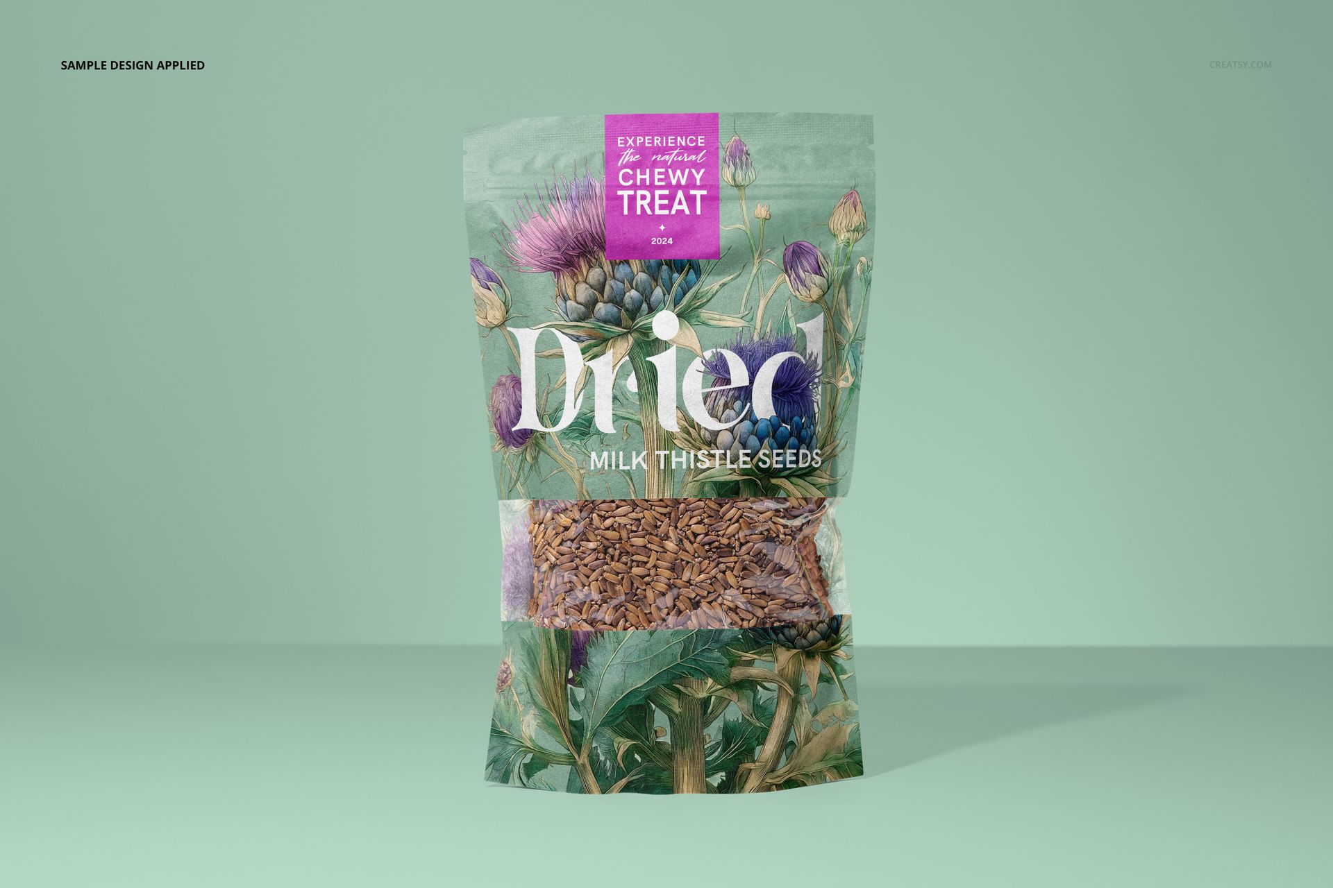 Front view of a paper pouch mockup for milk thistle seeds, featuring botanical illustrations and clear window with seeds.