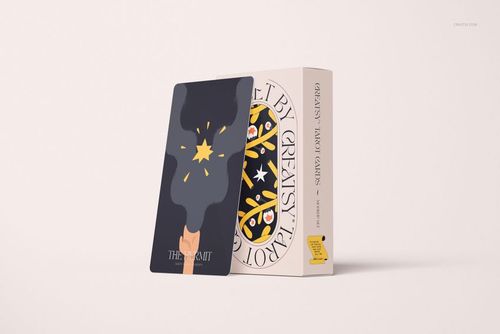 PSD mockup showing a single tarot card with a graphic design leaning against a boxed set, both on a neutral background.
