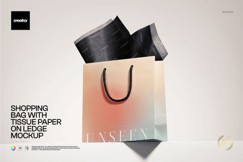 Shopping bag mockup with gradient colors and black tissue paper, positioned on a ledge under soft studio lighting.