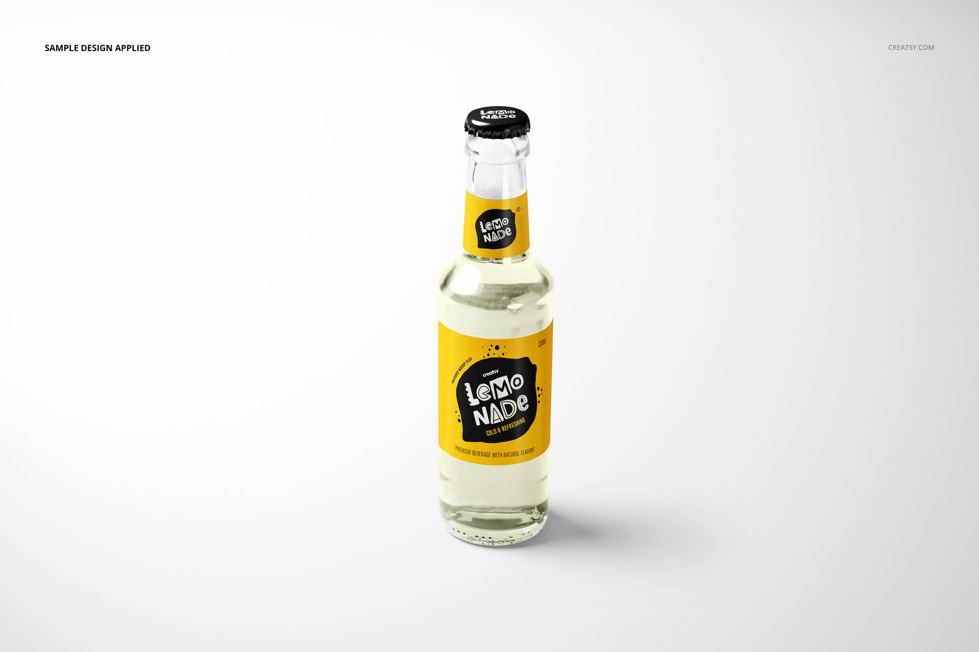 Clear glass lemonade bottle with yellow label and black cap, front view on a white background, PSD mockup scene.