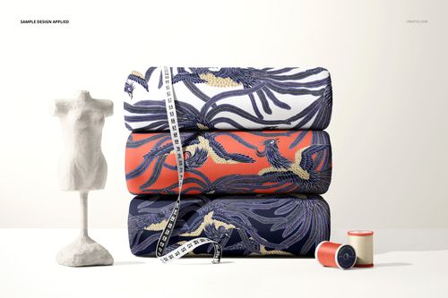 Stacked scuba fabric mockup featuring vibrant designs in blue, coral, and cream, with a measuring tape and mannequin.