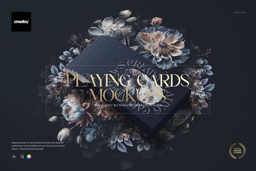 Mockup of two stacked playing card boxes in navy blue, surrounded by detailed floral illustrations and gold lettering.