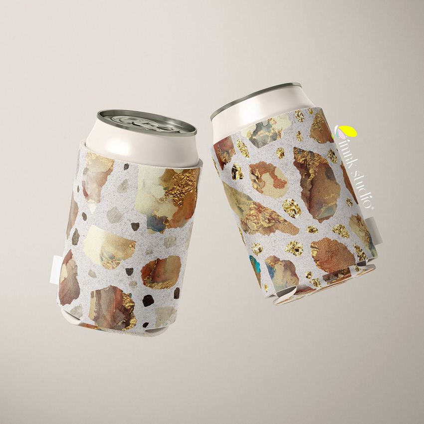 Neoprene can cooler mockup featuring two cans with abstract brown and gold patterns on a light background, floating in midair.