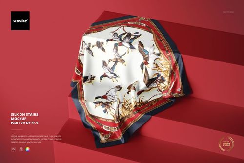 Elegant patterned silk cloth mockup laid over geometric steps, highlighting detailed bird and gold designs.