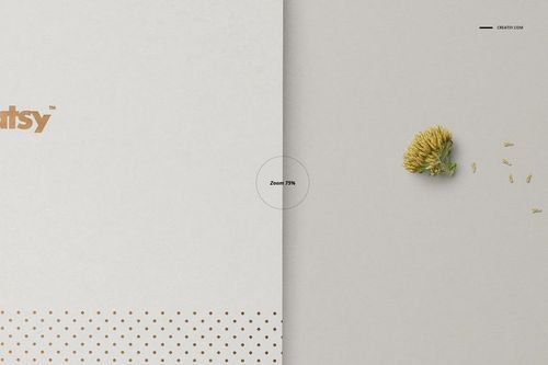 A5 notebook mockup with a white cover featuring gold dots, shown in a top view next to an open page with a yellow flower.