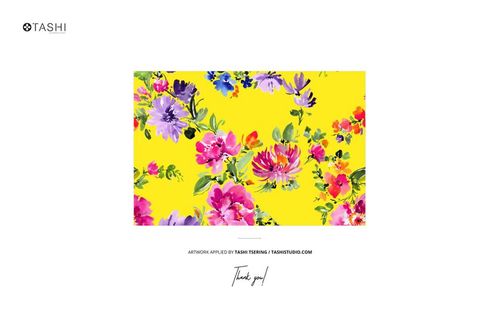 PSD mockup of cotton fabric with colorful flowers and green leaves on a yellow surface, displayed in a neat stack.