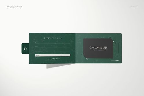 Open green gift card holder mockup with marble pattern, displaying a black gift card on a light background, top view.