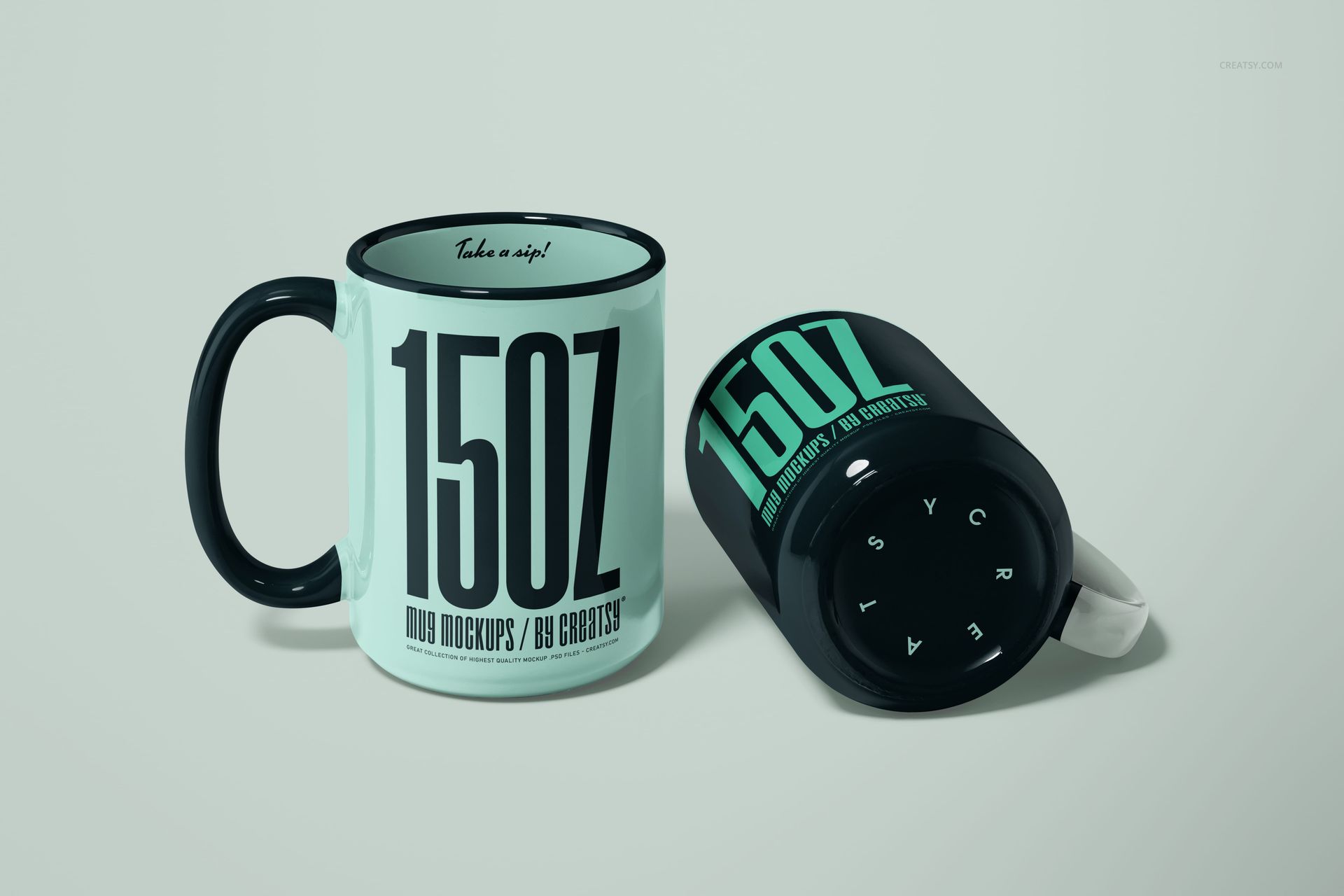 Two 15oz mugs in a mockup scene, one upright and one lying on its side, both with black handles and rims.