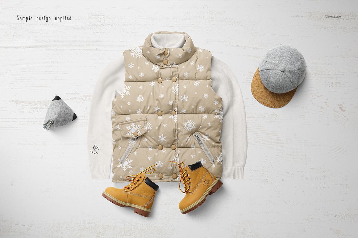 Boys winter set mockup featuring a beige snowflake-patterned vest, white sweater, tan boots, and gray cap on a light surface.