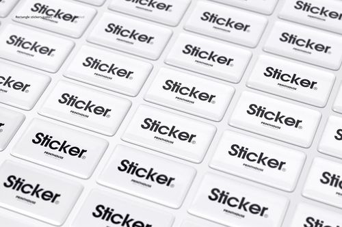 Mockup of epoxy dome stickers with bold black text on white backgrounds, shown in an organized grid scene.
