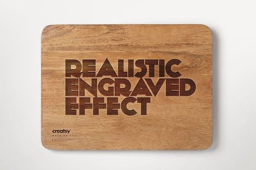 Engraved wooden board mockup featuring a realistic text effect, displayed flat against a clean white surface.