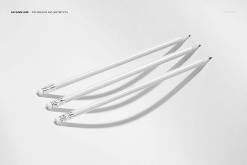 Three white pencils with black tips arranged diagonally on a light background, casting soft shadows.