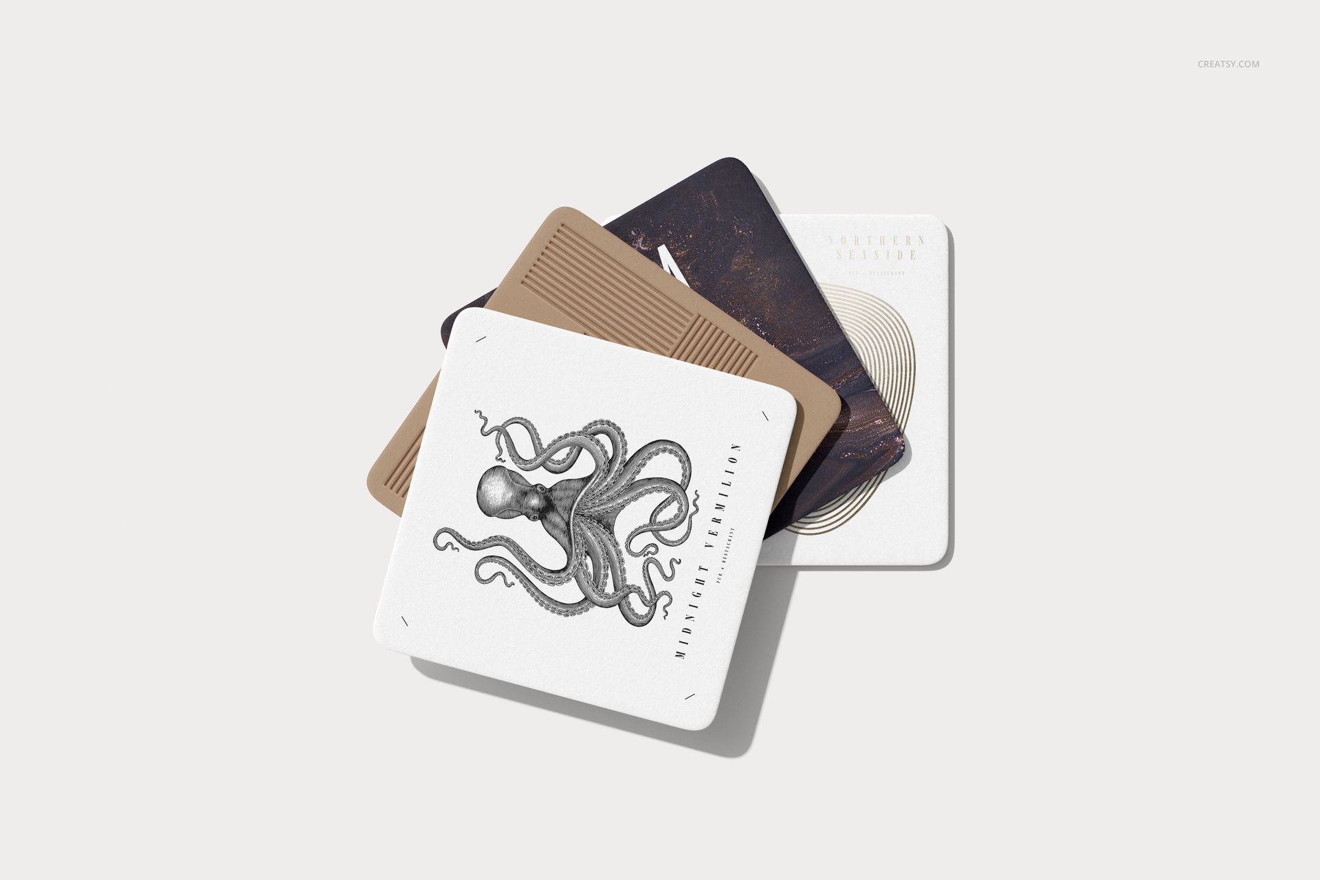 Square coasters mockup featuring various patterns and textures, shown from above on a plain surface.
