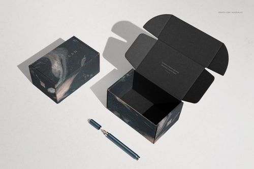 PSD mockup of two packaging boxes, one lid open and one closed, both with black and blue artistic patterns, top perspective.