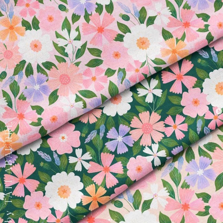 Cotton fabric mockup showing folded material with a colorful floral pattern in pink, white, and purple on green and light backgrounds.