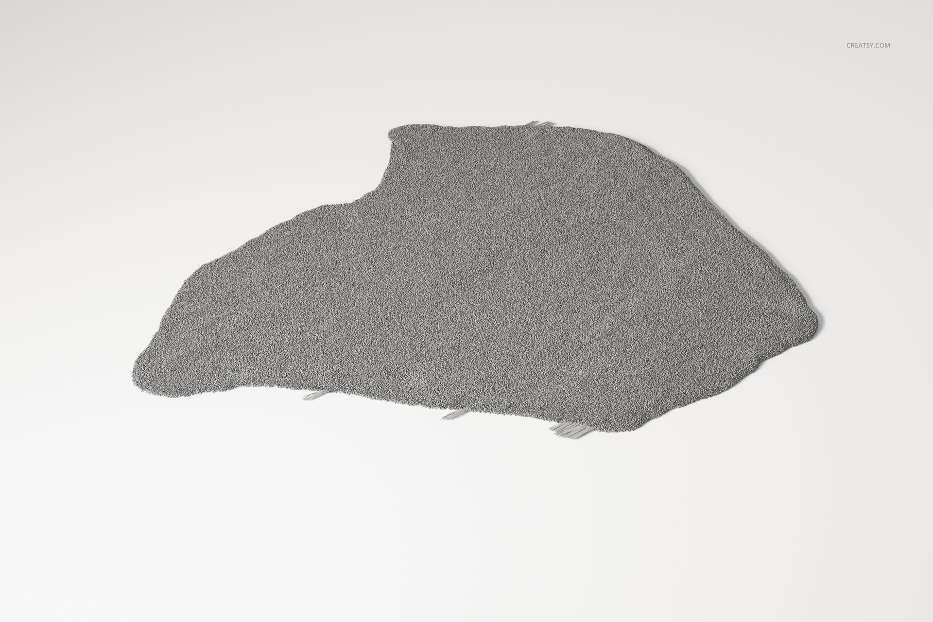 Gray rug shaped like a continent outline, displayed on a plain white surface from a top-down perspective.