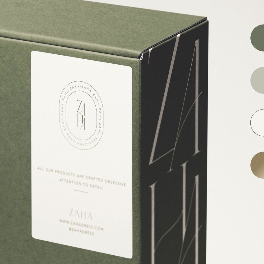 Shipping label mockup on a green cardboard box with a minimal design, featuring a circular logo and printed text details.