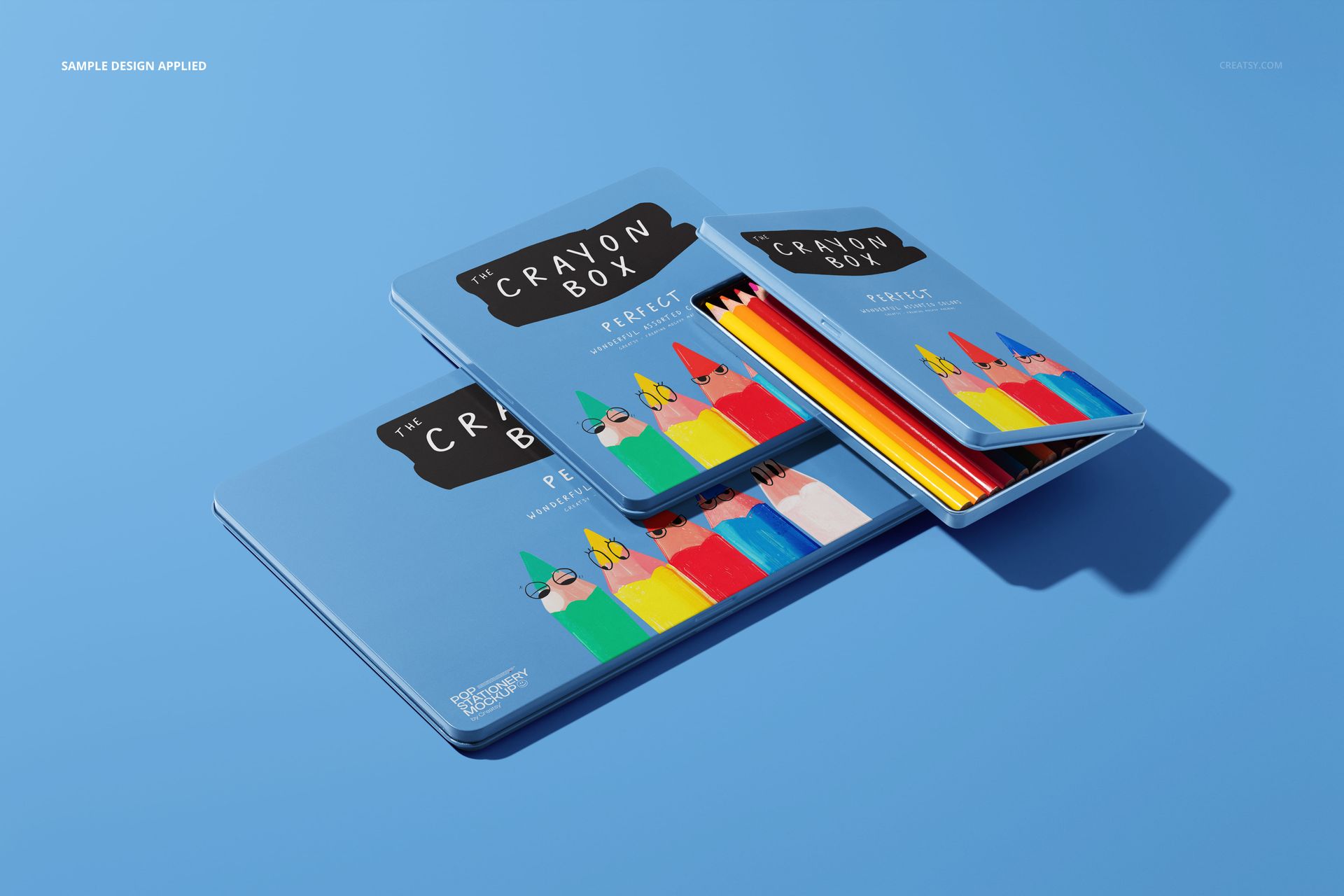 Crayon box mockup showing three blue rectangular boxes with vivid crayon graphics, displayed at different angles.