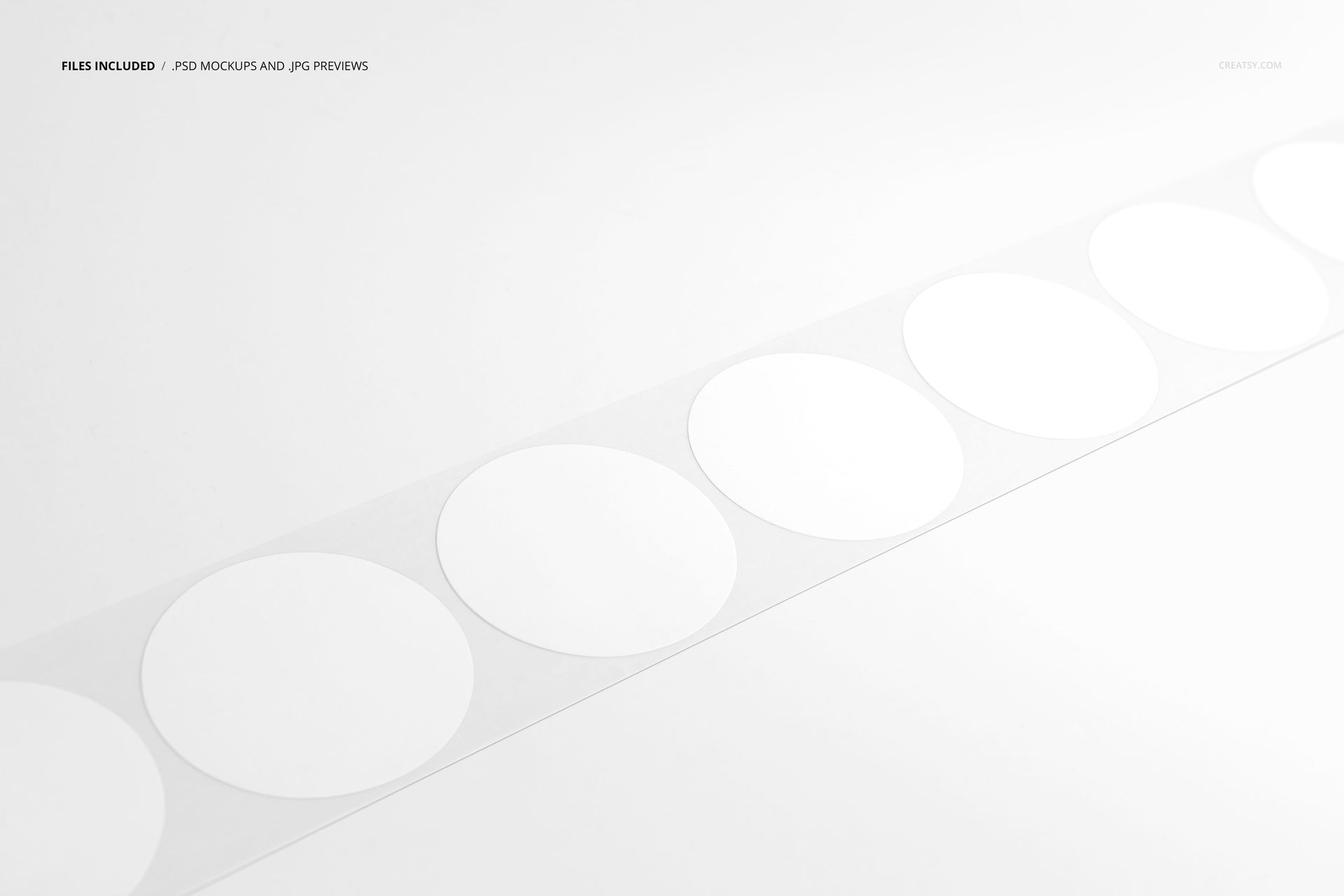 Set of blank round stickers on a clear tape strip, shown diagonally on a plain white background in a PSD mockup.