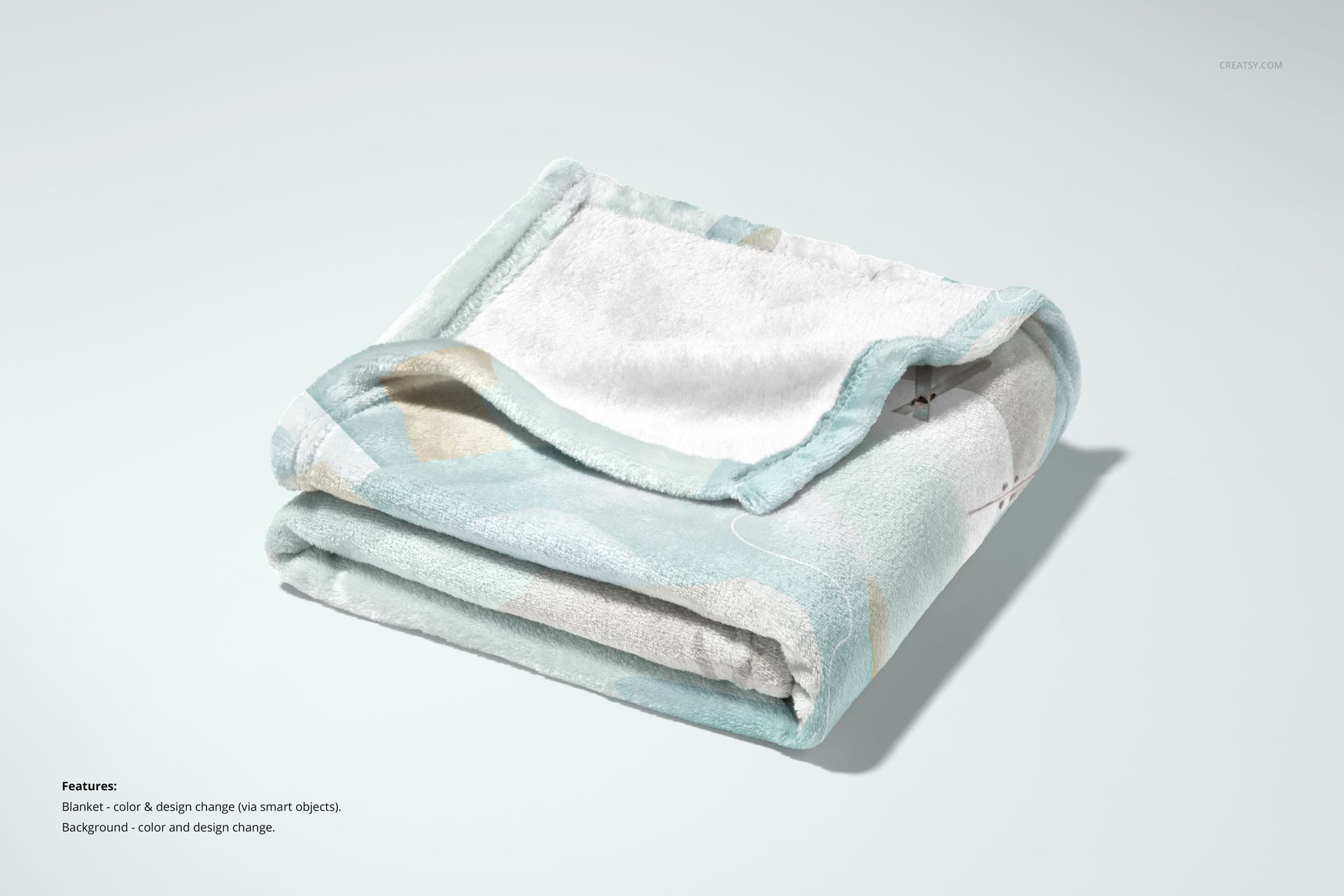 30x40 fleece blanket mockup showing a neatly folded blanket with subtle colors and gentle creases, studio setting.