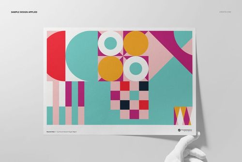 A3 fine art print mockup featuring geometric abstract shapes in pink, yellow, turquoise, and white, held by a gloved hand.