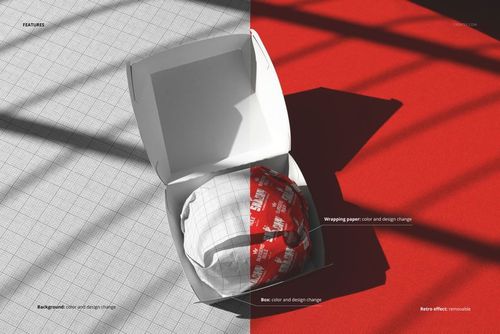 Top view of a burger box mockup with a wrapped burger inside, set against a half gray grid and half red surface.