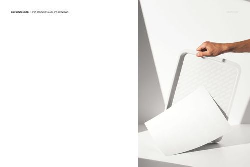 Fast food tray mockup with stickers, shown in a minimalist setting with a hand holding the tray and a blank paper sheet.