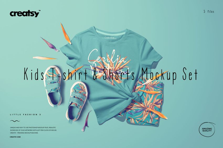 Kids t-shirt, shorts, and shoes mockup arranged with tropical flowers, viewed from above on a pale surface.
