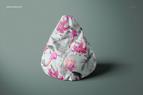 Front view of a bean bag chair mockup featuring a botanical pattern in shades of pink, gray, and white on a neutral surface.