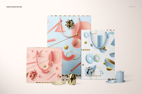 PSD mockup featuring pastel pink, blue, and white paper bags with geometric prints and festive ribbon decorations.