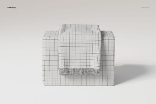 Fringe blanket with a grid pattern draped over a rectangular pedestal, shown from a front angle on a light background.