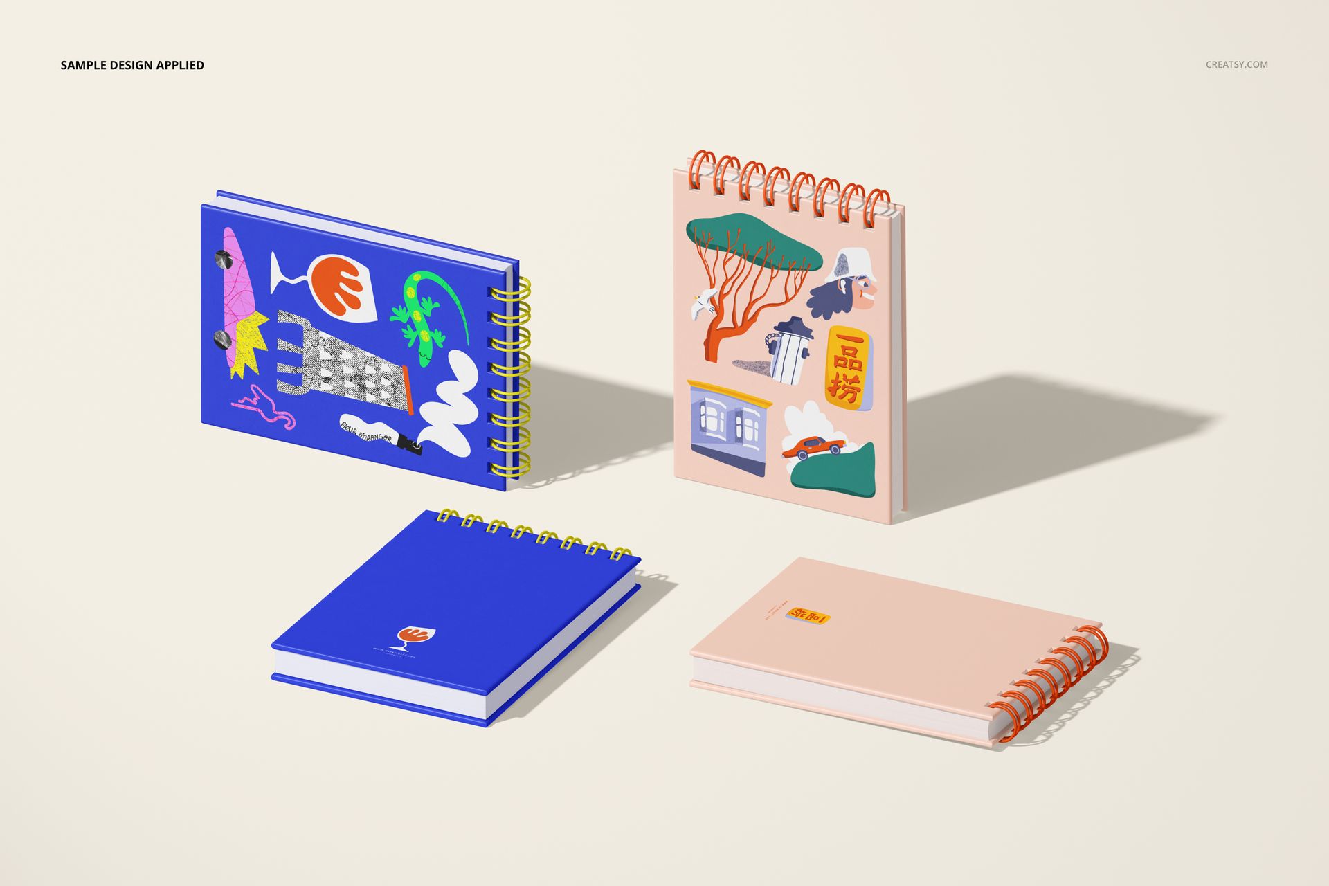 Four A6 spiral ring flip top notebooks with colorful covers, displayed on a light surface in angled view with shadows.