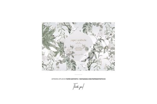 Wide cotton ribbon mockup featuring green and gray foliage print, displayed with sewing accessories in a flat lay.