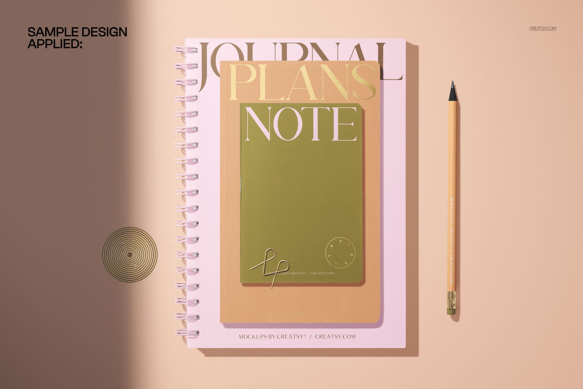 Front view of a spiral notebook and a softcover notebook mockup on a beige surface with a pencil and minimal shadows.