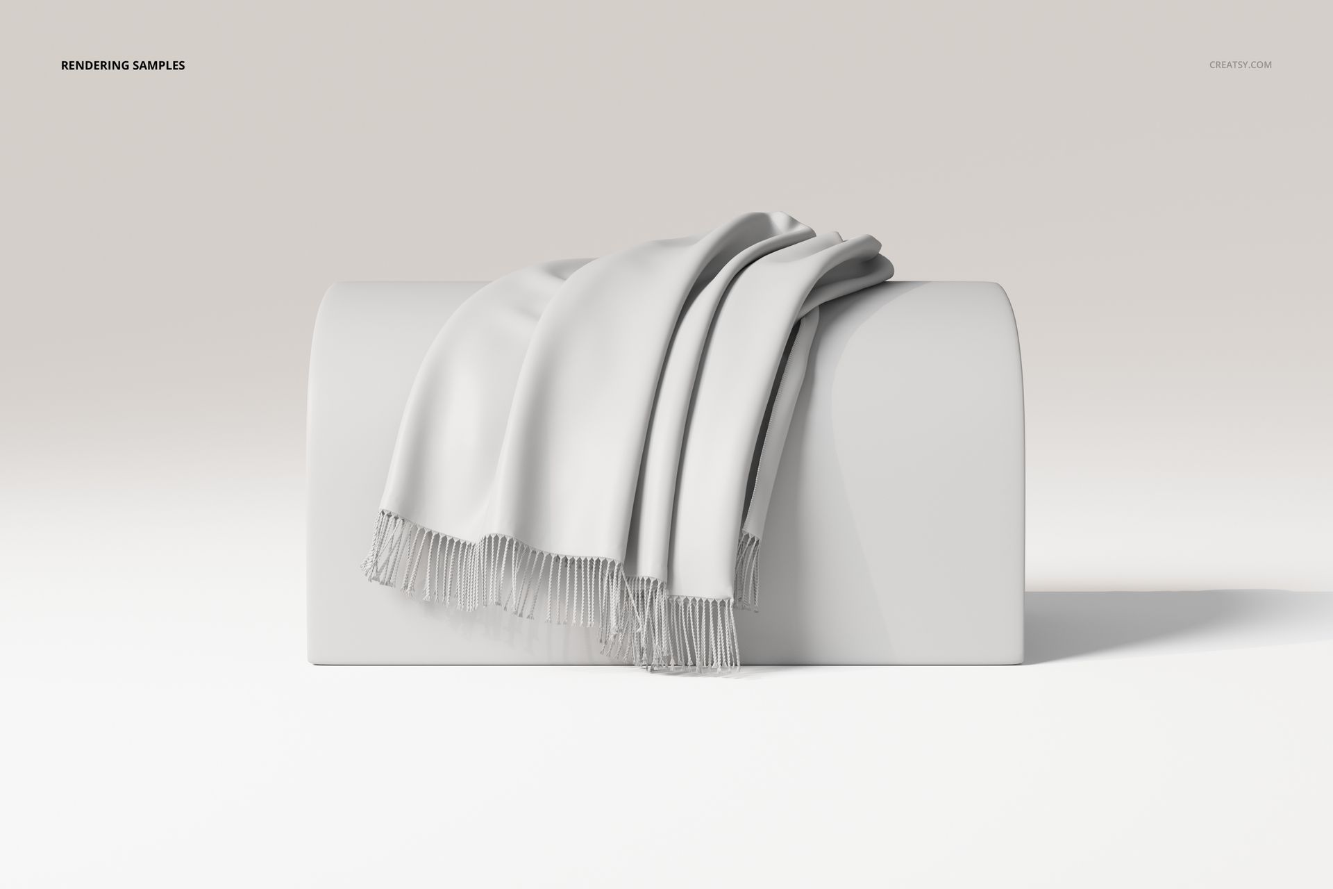 Draped throw blanket in light gray with fringed edges displayed on a curved white surface, front view.